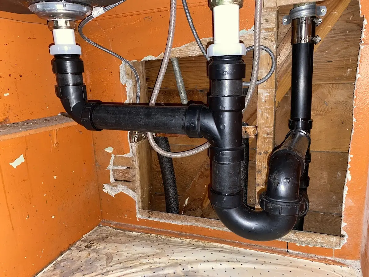 Professional Garbage Disposal Repair equipment and tools on the job in Dumont